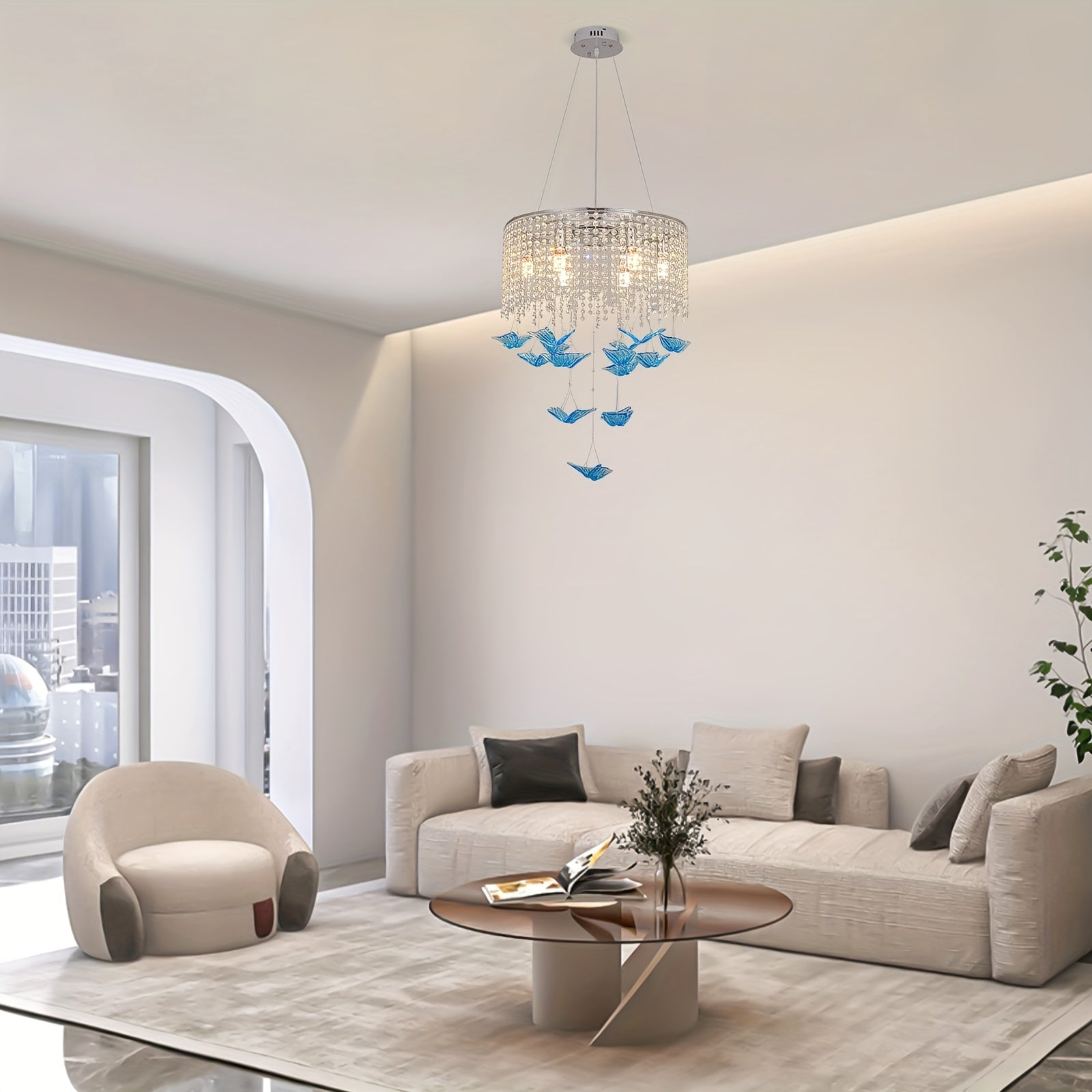 Modern living room featuring a butterfly light fixture with crystal detailing and blue hanging butterfly accents
