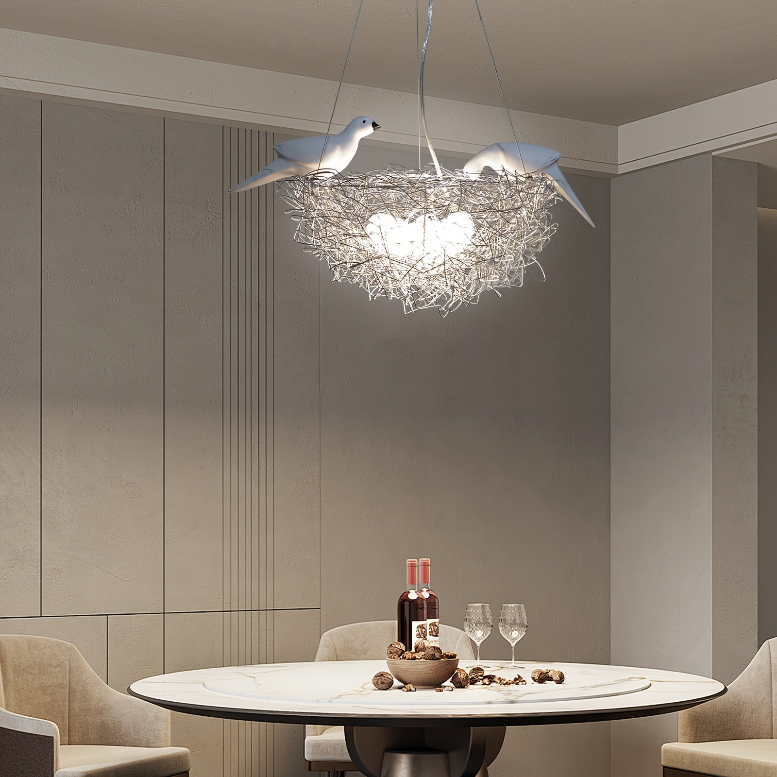 Elegant bird nest-style pendant light hanging above a round dining table set with wine and decor in a modern dining room