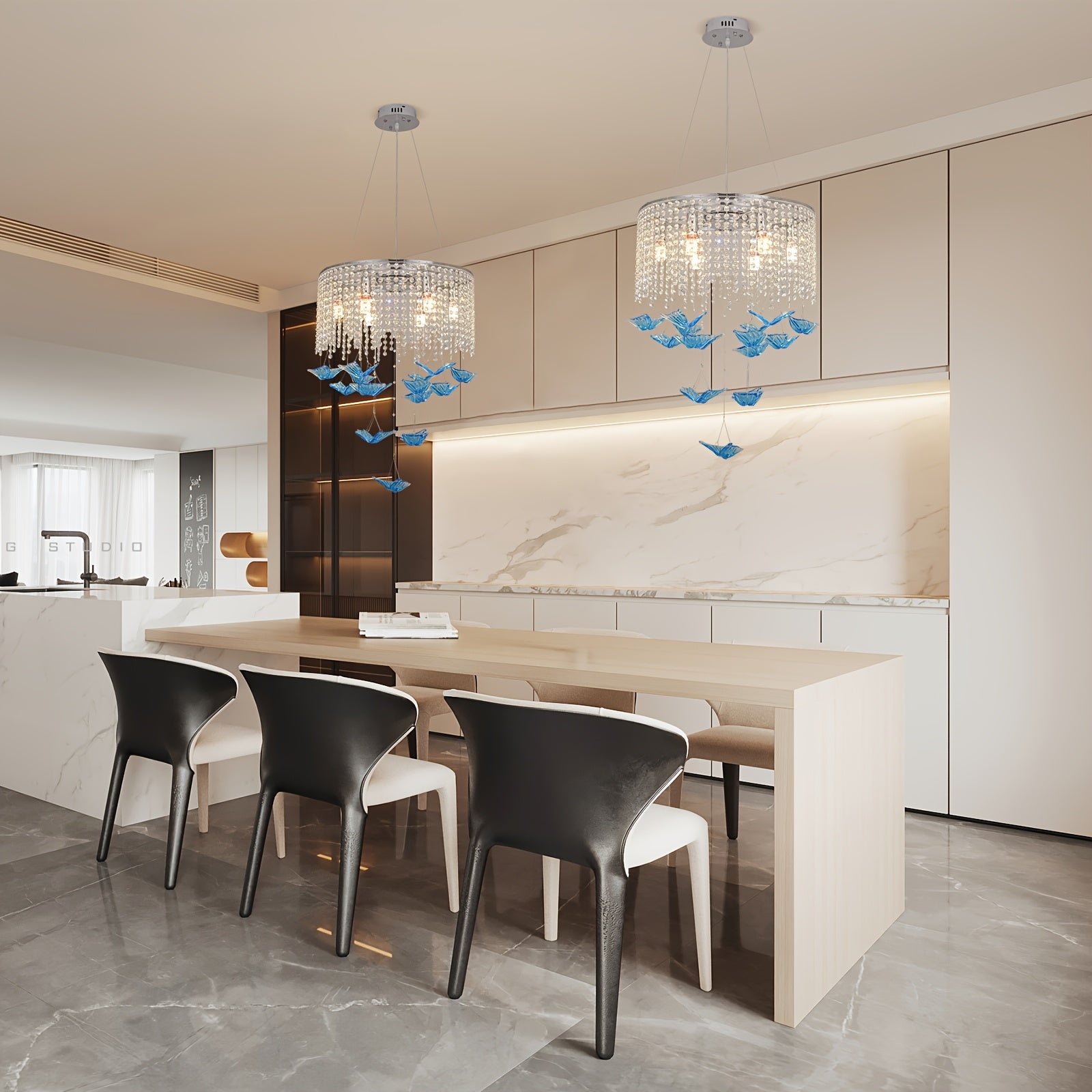 Contemporary kitchen with a dining island, illuminated by a butterfly light fixture featuring crystal strands and blue butterfly pendants