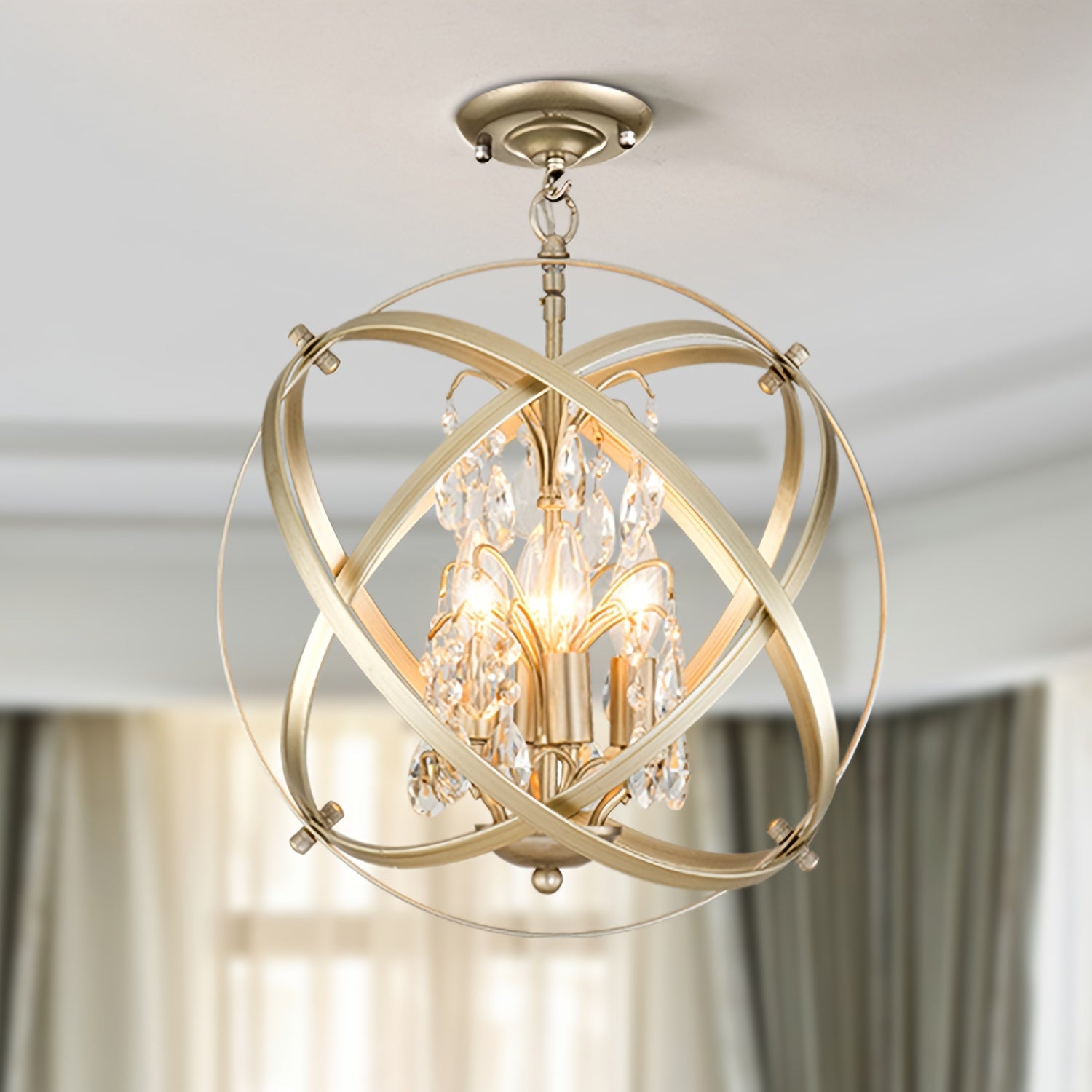 Intersecting metal bands surround candle-style bulbs and crystal drops, forming an elegant globe chandelier