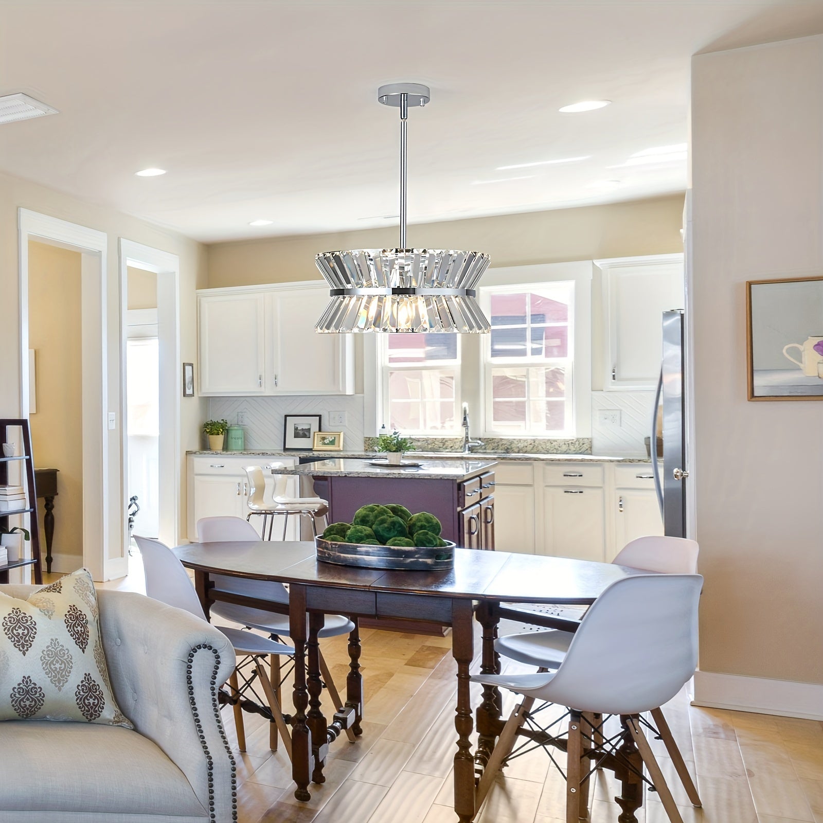 Semi flush crystal chandelier above dining table in open kitchen, adding a bright and elegant ceiling light touch