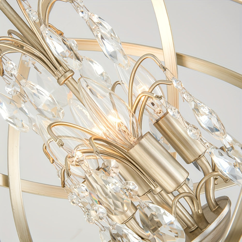 Close-up view of a gold chandelier showcasing crystal globe elements, candle-style sockets, and hanging prism accents