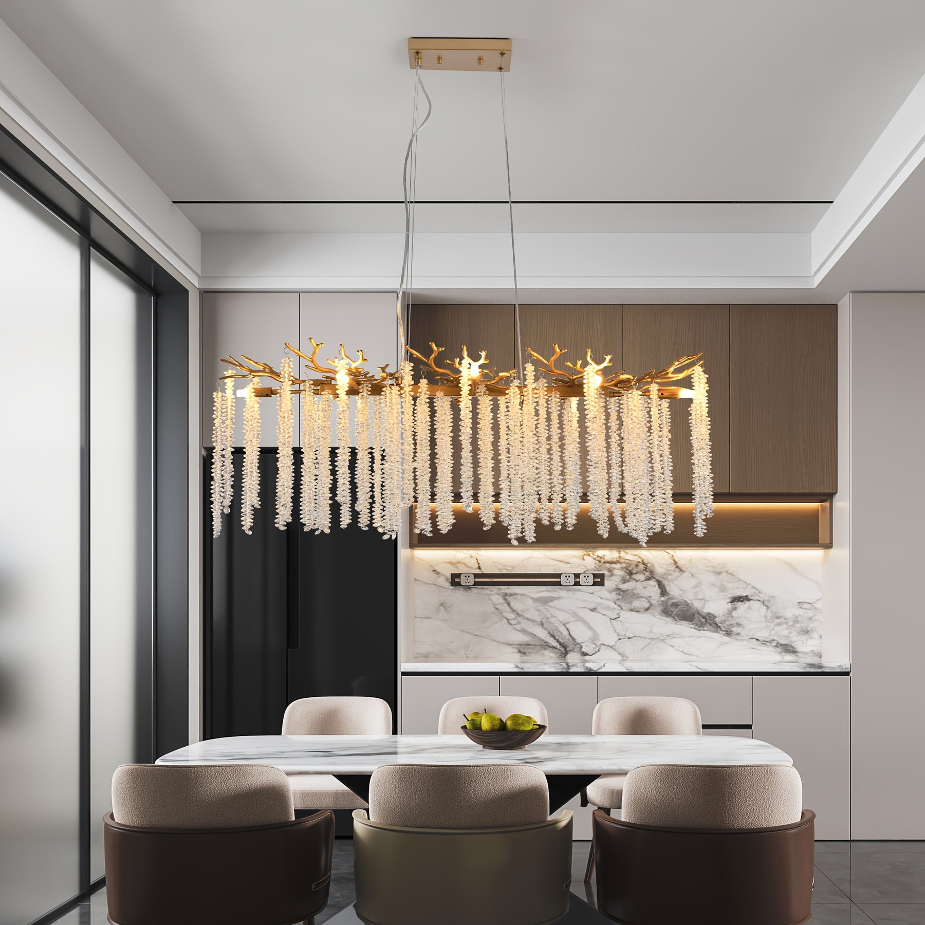 Hanging light fixture with gold branch frame and crystal strands, illuminating a marble dining table