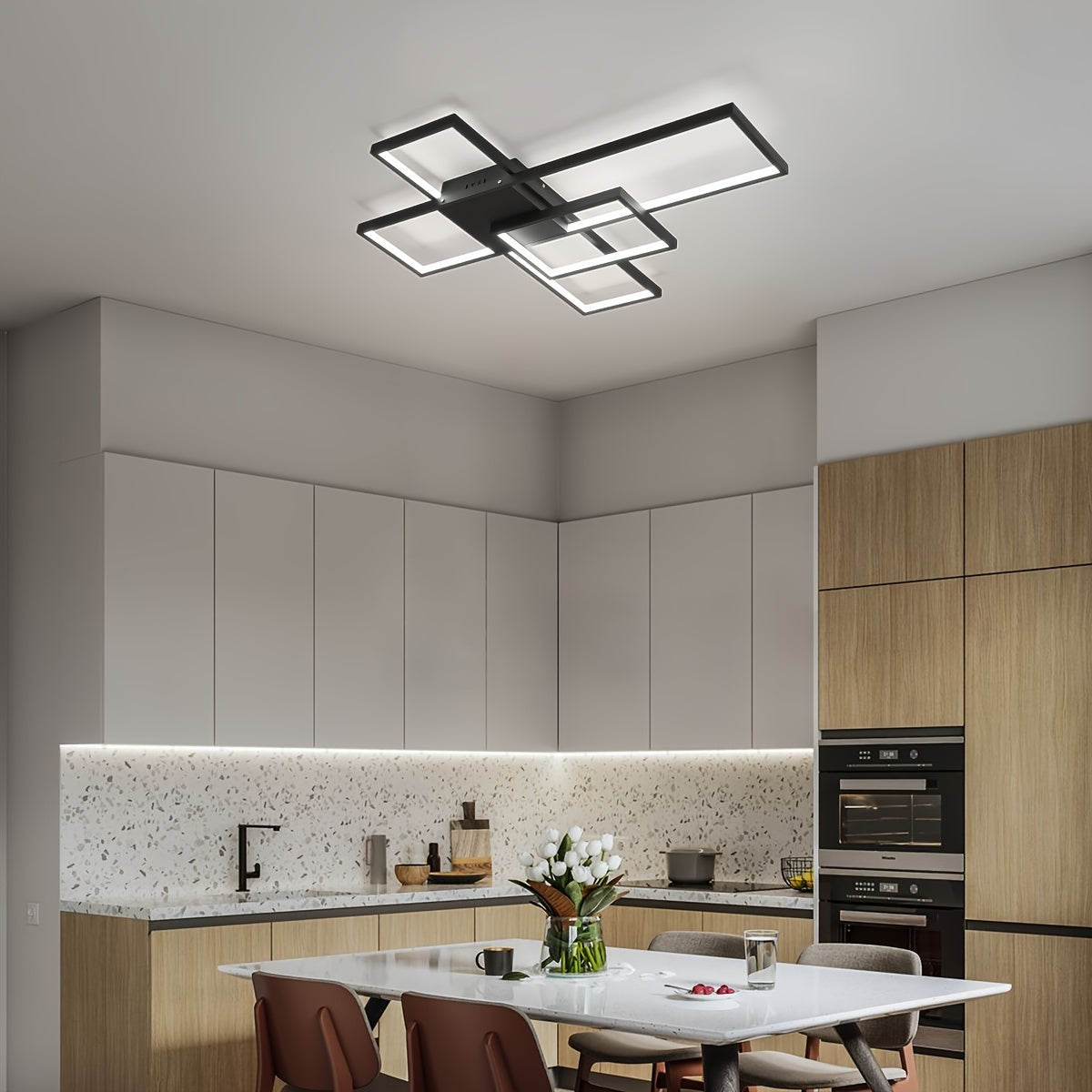 Kitchen with built-in wood cabinetry and a black geometric LED ceiling light installed above a rectangular dining table