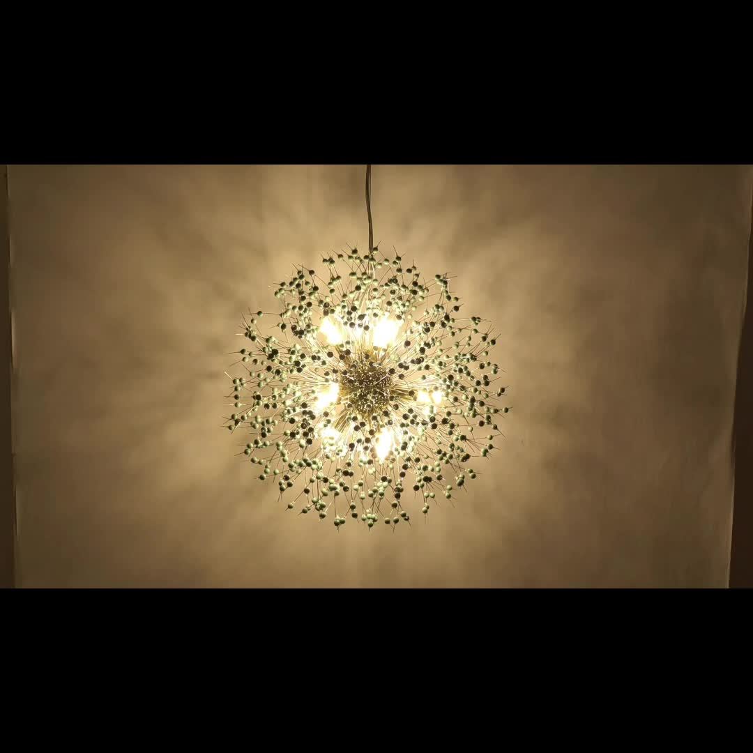 Brightly lit starburst pendant light, showcasing its intricate spherical design and radiant glow