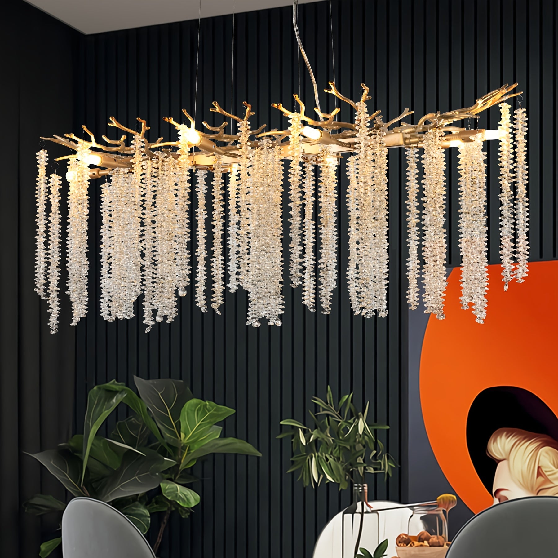 Branch-style crystal chandelier glowing above a modern dining setup, enhancing the space with artistic lighting and elegant detail