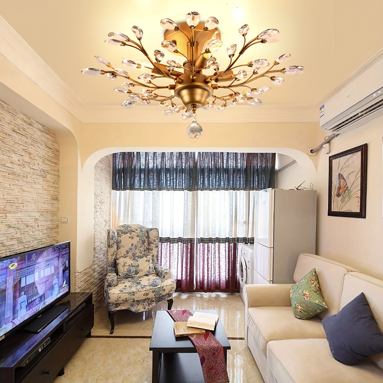 Cozy living room with a gold vintage ceiling light fixture featuring crystal branches, adding a touch of elegance above neutral furniture