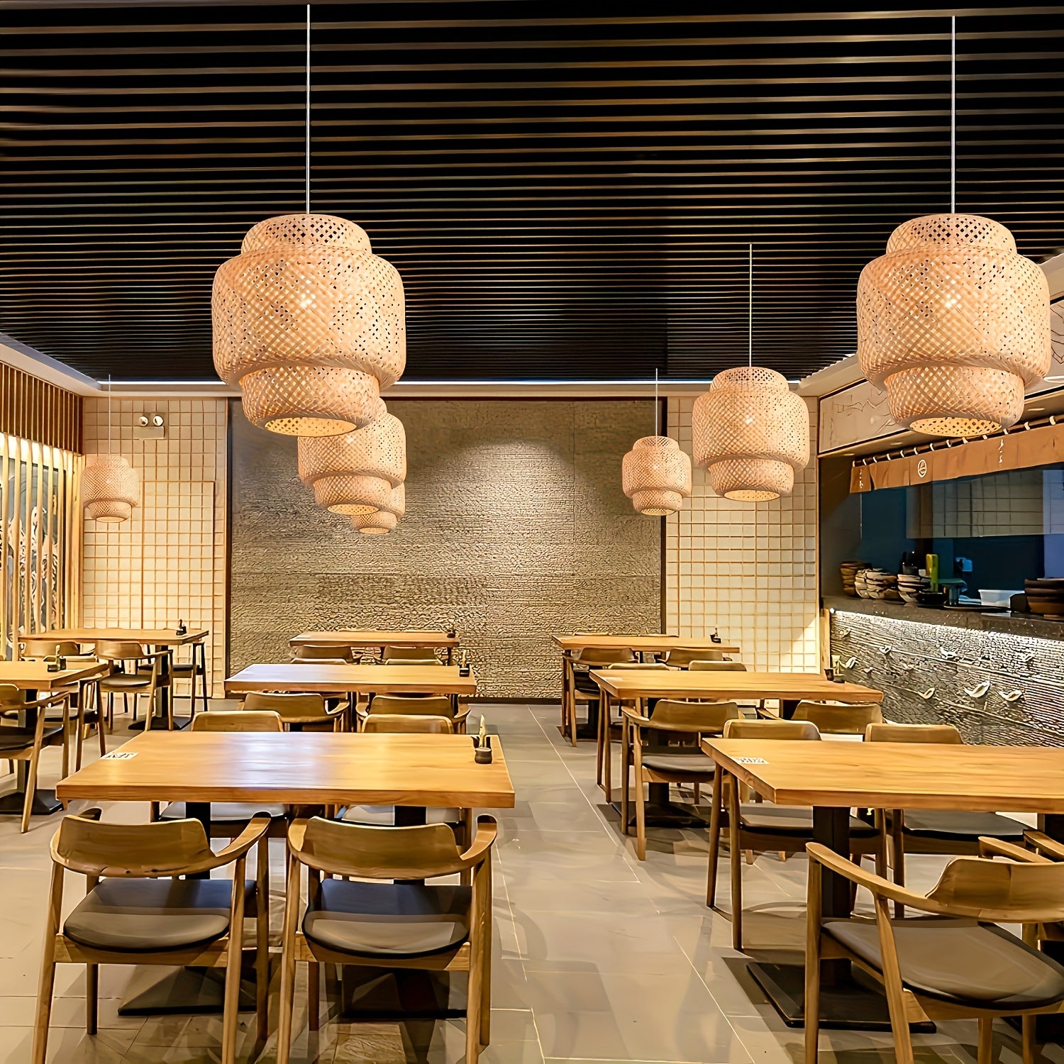 Wooden dining tables arranged in a cozy space with hanging natural lamps, finished with a touch of rattan ceiling light fixture