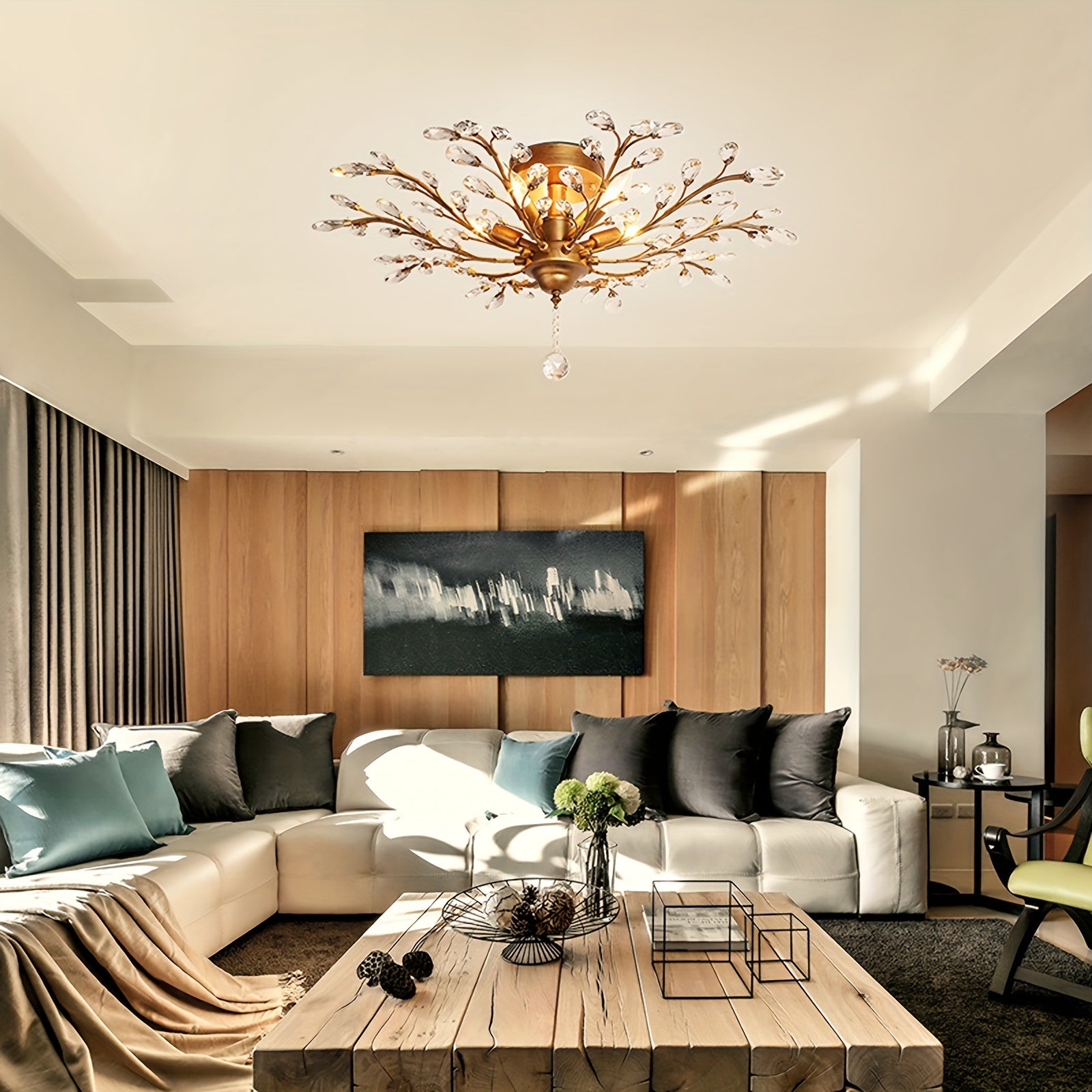 Crystal-tipped floral fixture mounted on the ceiling, featuring a golden vintage ceiling light that brightens a modern seating area with sofa and wooden table