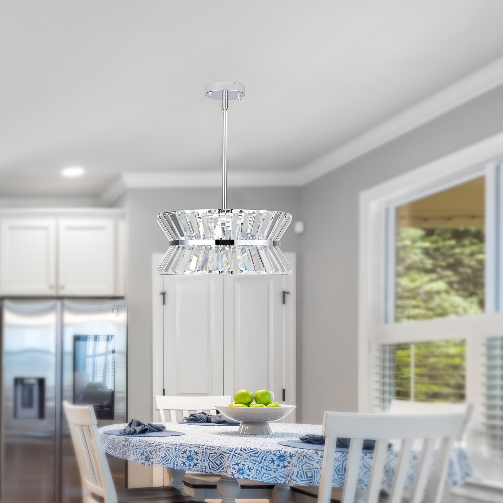 Modern semi flush crystal chandelier installed above a dining table in a bright kitchen, featuring clear crystal design and chrome finish for contemporary home decor