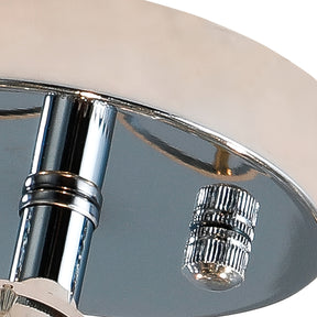 Chrome ceiling canopy and mounting hardware on a bubble light fixture, highlighting its polished finish and secure attachment