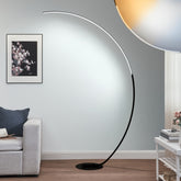 Stylish arc floor lamp casting bright, cool illumination across a contemporary interior space with a sofa and artwork