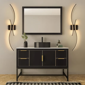 Modern bathroom vanity highlighted by two curved contemporary LED wall lights on both sides of a mirror, creating soft ambient illumination