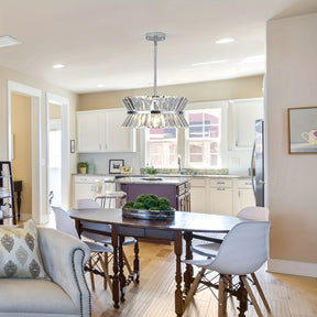 Semi flush crystal chandelier above dining table in open kitchen, adding a bright and elegant ceiling light touch