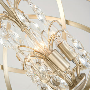 Close-up view of a gold chandelier showcasing crystal globe elements, candle-style sockets, and hanging prism accents