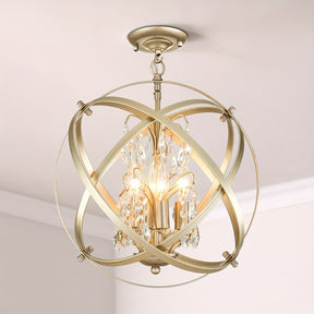 Gold chandelier with a crystal globe design, intersecting metal bands, and hanging crystals around candle-style bulbs