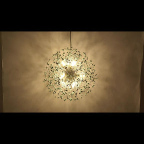 Brightly lit starburst pendant light, showcasing its intricate spherical design and radiant glow