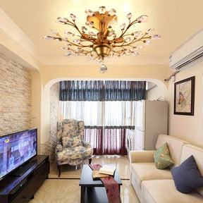 Cozy living room with a gold vintage ceiling light fixture featuring crystal branches, adding a touch of elegance above neutral furniture