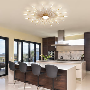 Bright dining and kitchen space with a gold sputnik ceiling light for bedroom installed above the island, surrounded by bar stools and glass doors