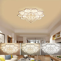 Petal-shaped ceiling light with crystal accents, shown in a bright interior featuring soft furniture and three adjustable glow options