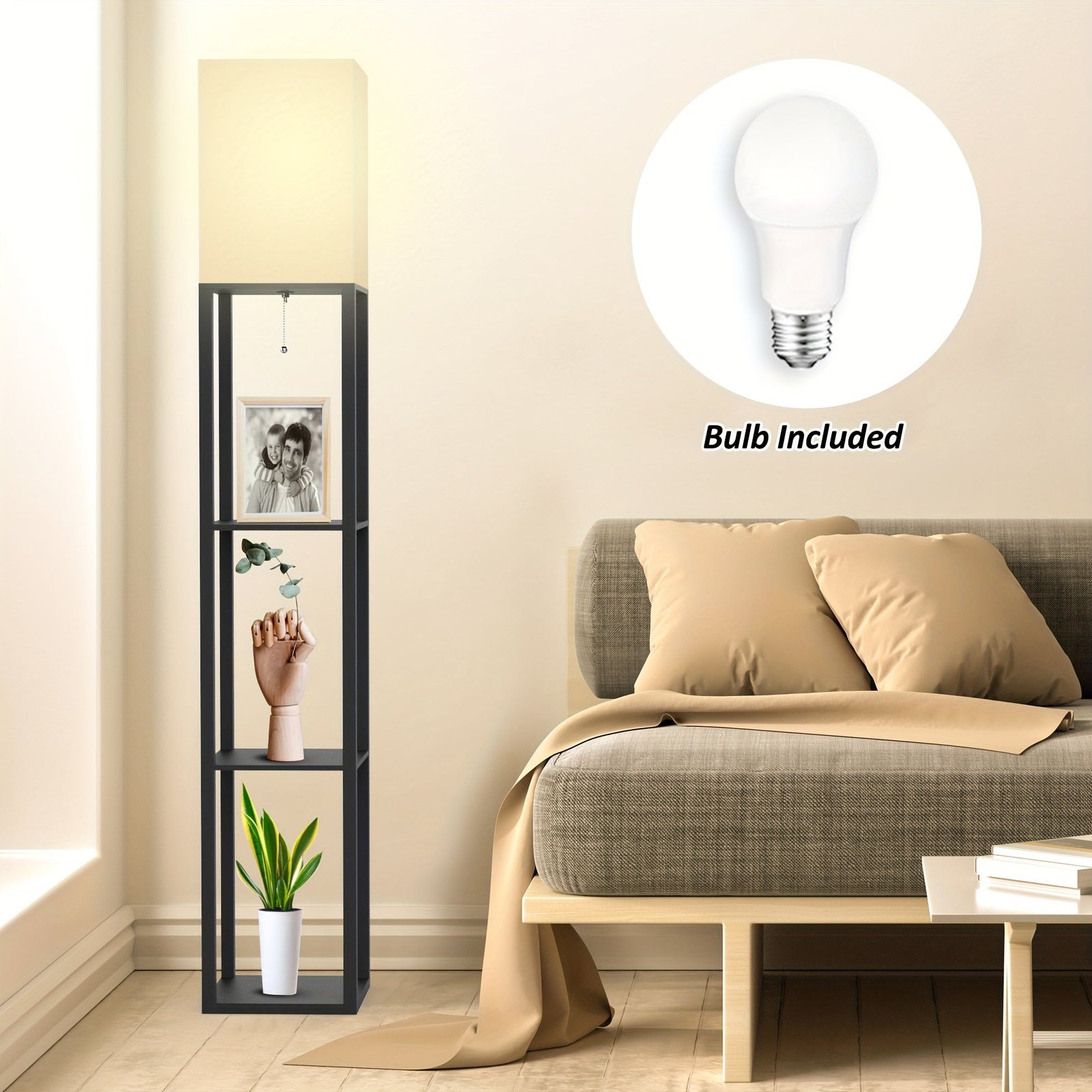 Standing light with open shelves holding decor pieces beside a bed, topped with a square fabric shade and bulb included in a Black threshold floor lamp