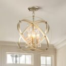 Ceiling-mounted crystal globe chandelier with brass metal bands and hanging crystal accents surrounding a warm exposed bulb