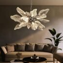 An elegant flower-shaped light fixture with textured glass leaves, illuminating a contemporary living room space