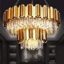 Statement gold chandelier with layered crystal prisms and 17 lights, adding a dramatic glow to a refined interior space